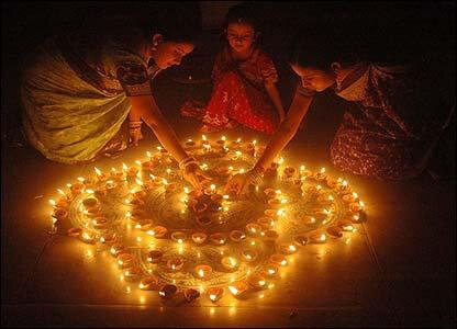 Rows of glowing diyas arranged during Diwali celebrations