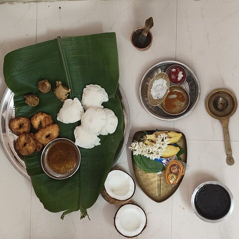 Traditional Diwali food offerings arranged on a banana leaf in Tamil Nadu
