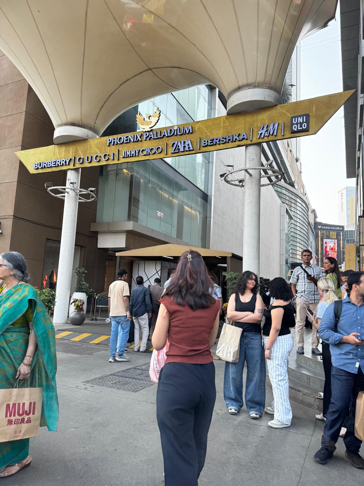 Visitors outside the Phoenix Palladium shopping mall entrance
