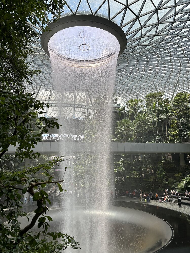 Rain Vortex waterfall beneath the glass roof at Jewel Changi Airport